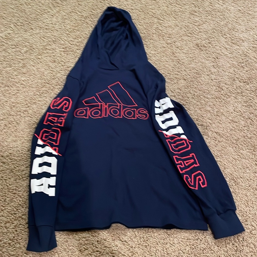 Blue adidas sweatshirt with red and white text